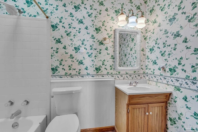 full bathroom featuring toilet, vanity, and tiled shower / bath