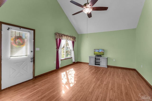 unfurnished living room featuring light hardwood / wood-style floors, high vaulted ceiling, and ceiling fan