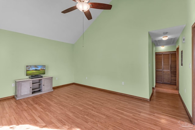 unfurnished living room featuring high vaulted ceiling, ceiling fan, and light hardwood / wood-style flooring