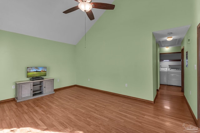 unfurnished living room featuring light wood-type flooring, high vaulted ceiling, separate washer and dryer, and ceiling fan