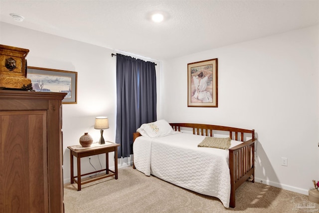 bedroom with light colored carpet