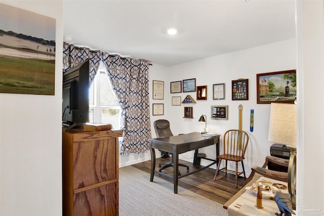 home office with wood-type flooring