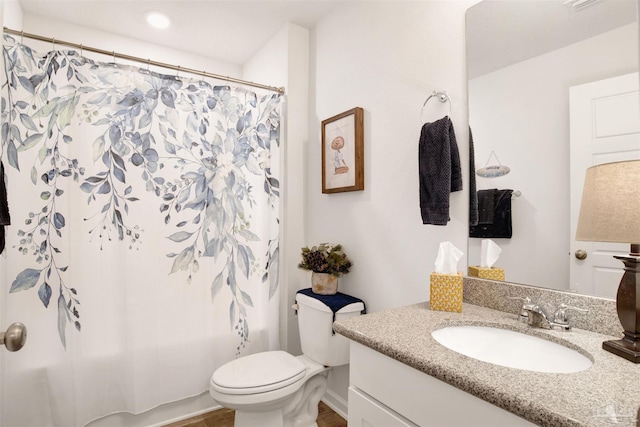 full bathroom featuring toilet, vanity, and shower / bath combination with curtain