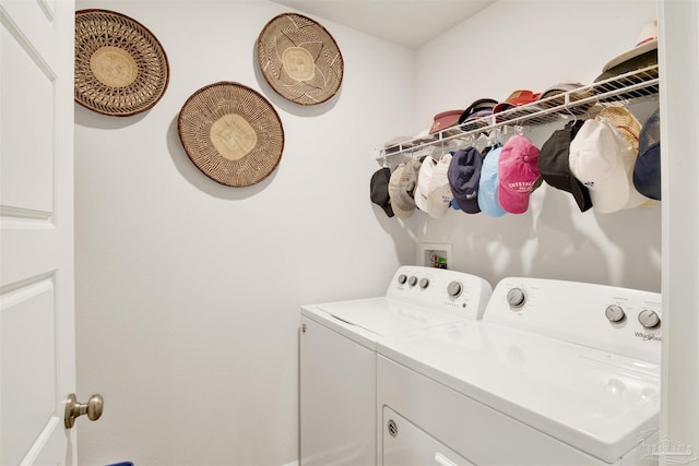 laundry room with independent washer and dryer