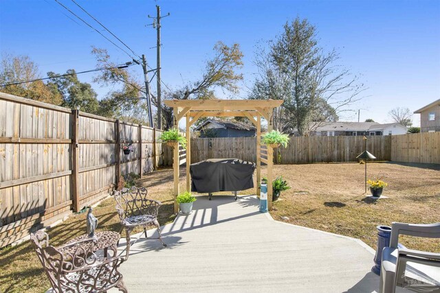 view of patio with a grill