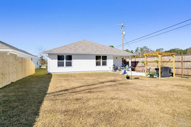 back of property featuring a pergola, a patio, and a yard