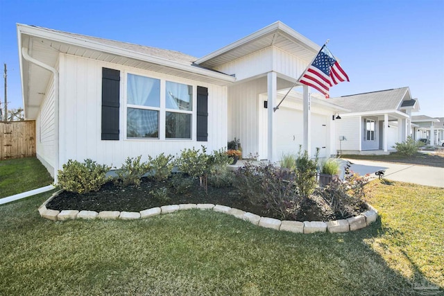 ranch-style house with a front lawn