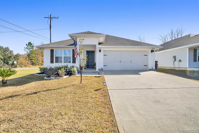 ranch-style house featuring a front lawn and a garage