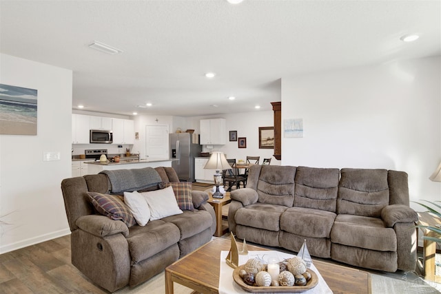 living room with hardwood / wood-style flooring