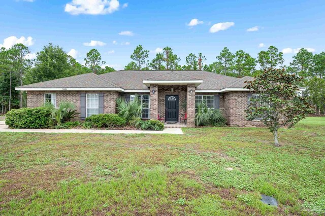 single story home featuring a front yard