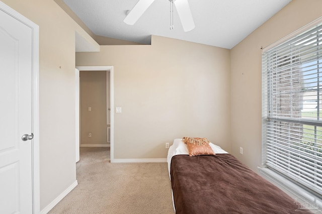 carpeted bedroom featuring baseboards and a ceiling fan