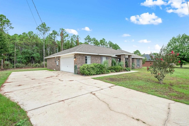 single story home featuring a front lawn, concrete driveway, brick siding, and an attached garage