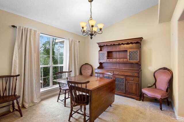 home office with a chandelier, light carpet, and a textured ceiling