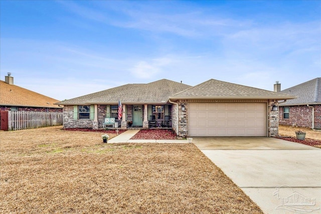 single story home featuring a garage and a front lawn