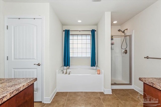 bathroom with tile patterned floors, vanity, and separate shower and tub