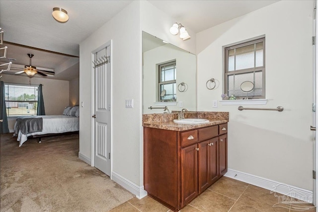 bathroom featuring tile patterned flooring, vanity, and ceiling fan