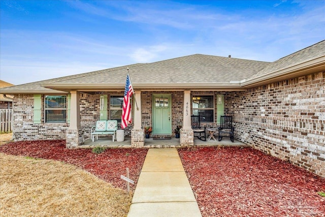 entrance to property featuring covered porch