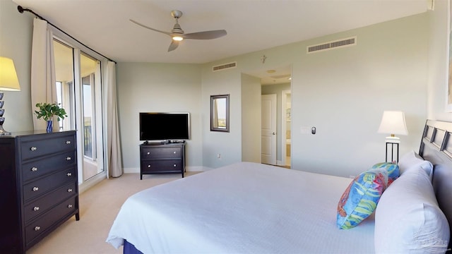 bedroom featuring light carpet, baseboards, and ceiling fan
