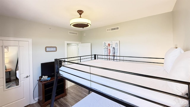 bedroom with wood finished floors