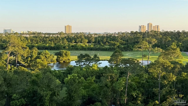 aerial view of property's location with a nearby body of water and nearby urban area