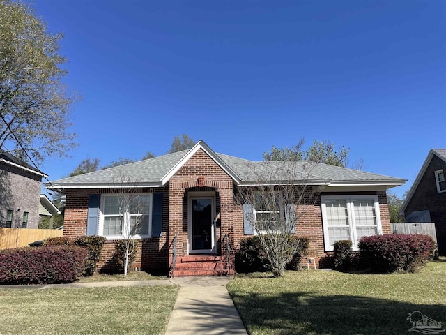 1834 E Hernandez St, Pensacola, FL 32503 - bungalow featuring brick siding, roof with shingles, and entry steps