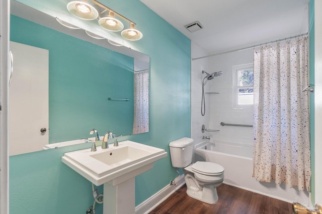 bathroom featuring shower / tub combo with curtain, wood-type flooring, and toilet