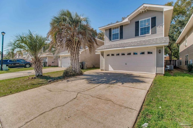 traditional-style home featuring a garage, concrete driveway, a front yard, and central air condition unit