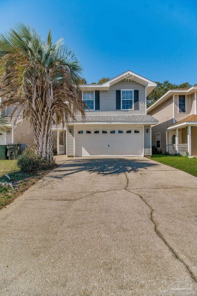 view of front of home featuring aphalt driveway and an attached garage