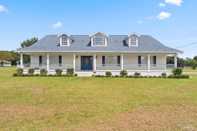 view of front of home featuring covered porch and a front yard