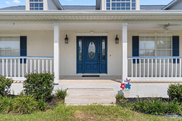 doorway to property with a porch