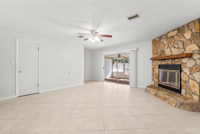 unfurnished living room with light tile patterned floors, ceiling fan, a fireplace, and visible vents