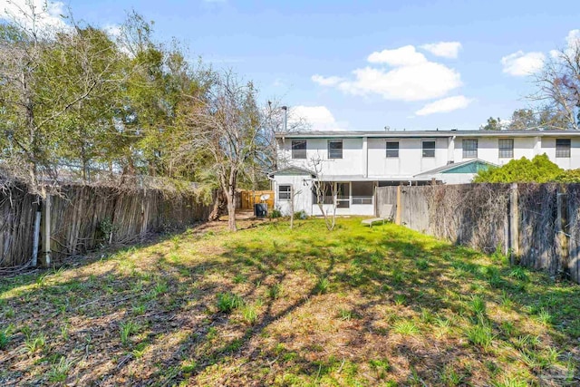 view of yard with a fenced backyard