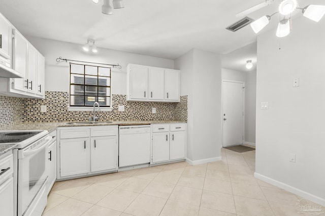 kitchen with tasteful backsplash, white appliances, white cabinetry, and a sink