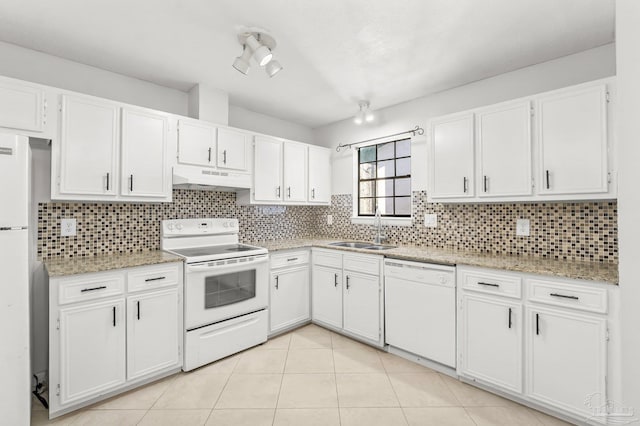 kitchen with tasteful backsplash, white cabinetry, a sink, white appliances, and under cabinet range hood