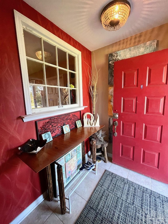 foyer entrance with tile patterned flooring