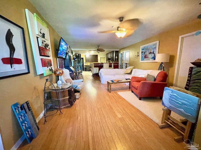 bedroom featuring a ceiling fan and wood finished floors