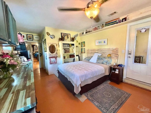 bedroom with a ceiling fan and visible vents