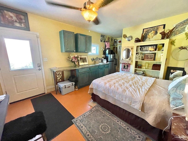 bedroom with a ceiling fan and a fireplace