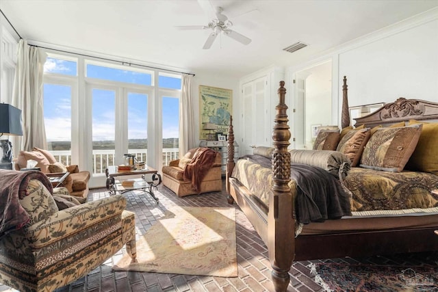 1220 State Highway 180, Gulf Shores, AL 36542 - bedroom featuring brick flooring, access to exterior, a water view, and ceiling fan