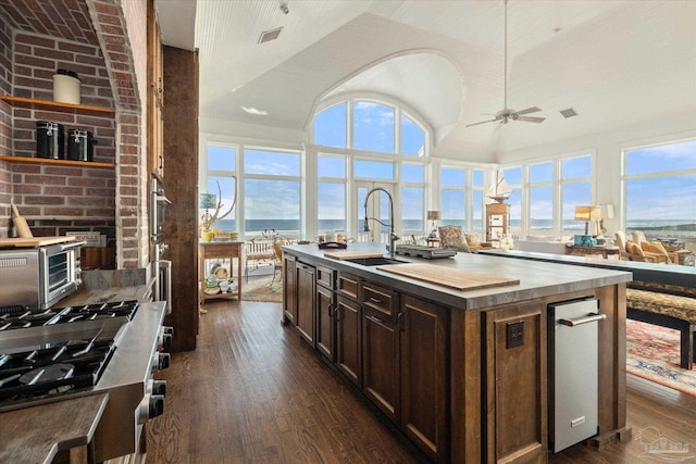 1220 State Highway 180, Gulf Shores, AL 36542 - kitchen with a sink, dark wood-type flooring, wooden counters, a ceiling fan, and dark brown cabinets