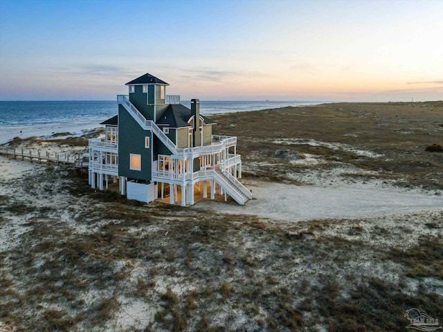 1220 State Highway 180, Gulf Shores, AL 36542 - back of property with a view of the beach, a balcony, a deck with water view, and stairway