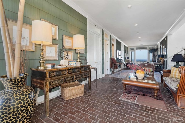 1220 State Highway 180, Gulf Shores, AL 36542 - living room with brick flooring, crown molding, and recessed lighting