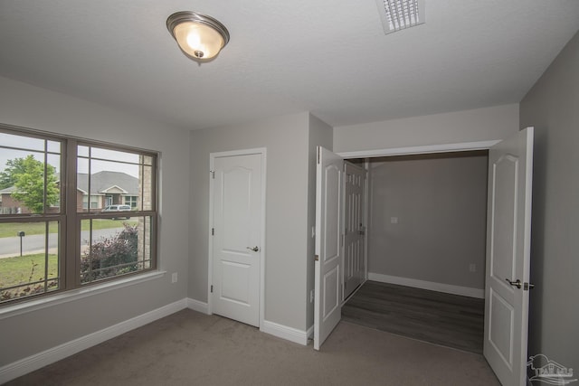 3620 Ranch Dr, Crestview, FL 32539 - unfurnished bedroom with baseboards and carpet floors