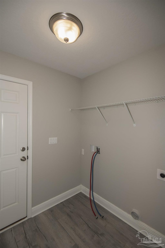 3620 Ranch Dr, Crestview, FL 32539 - laundry room with dark wood finished floors, baseboards, and washer hookup