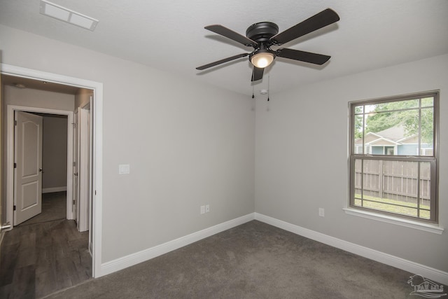3620 Ranch Dr, Crestview, FL 32539 - unfurnished room with ceiling fan, baseboards, and dark colored carpet