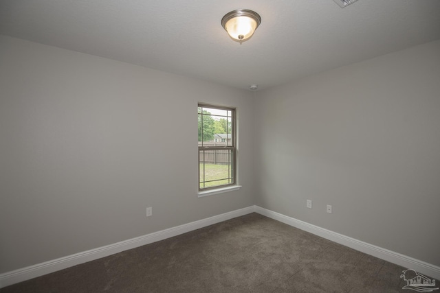 3620 Ranch Dr, Crestview, FL 32539 - empty room featuring dark carpet and baseboards