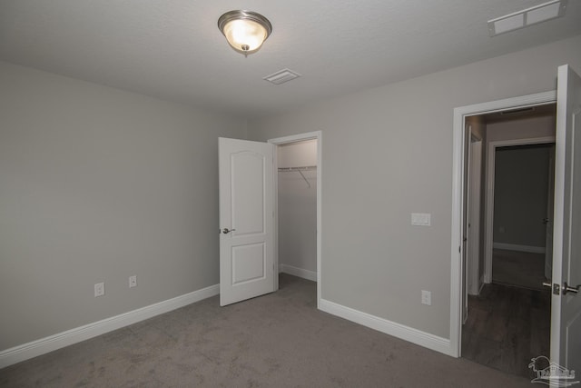 3620 Ranch Dr, Crestview, FL 32539 - unfurnished bedroom featuring baseboards, carpet floors, a closet, and a spacious closet