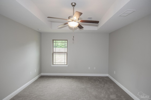 3620 Ranch Dr, Crestview, FL 32539 - empty room with a tray ceiling, carpet floors, and ceiling fan