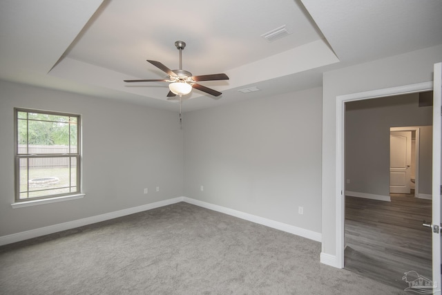 3620 Ranch Dr, Crestview, FL 32539 - carpeted empty room featuring a ceiling fan, a raised ceiling, and baseboards