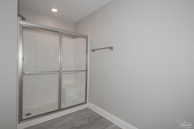 3620 Ranch Dr, Crestview, FL 32539 - full bathroom with baseboards, wood finished floors, a shower with door, and recessed lighting